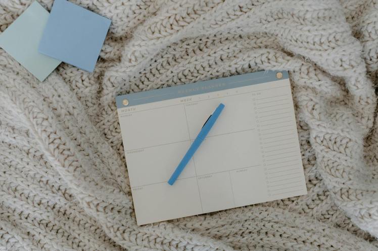 Blank calendar with a pen.